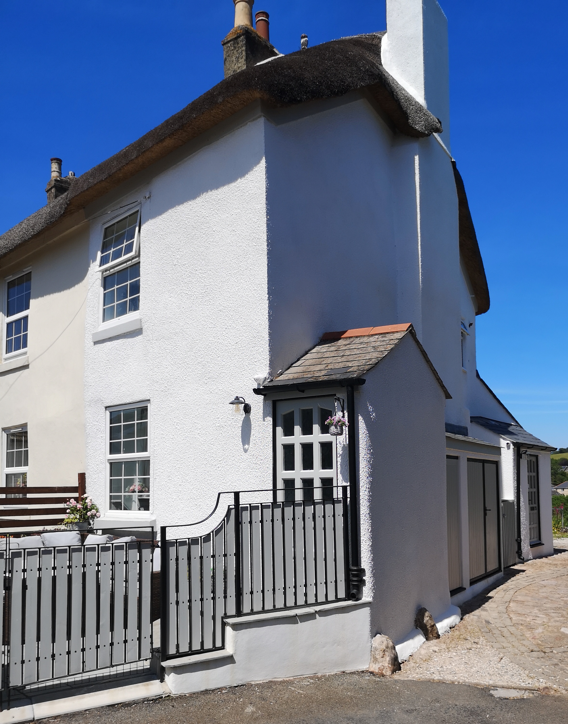 James Fletcher Bespoke Mouldings & Plastering Contractors Exterior Rendering of Thatched Cottage